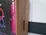 a cardboard box that has a speaker inside of it