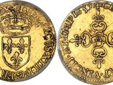 a gold coin with a crown on top of it