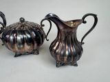 two silverplated teapots and a silverplated teapot
