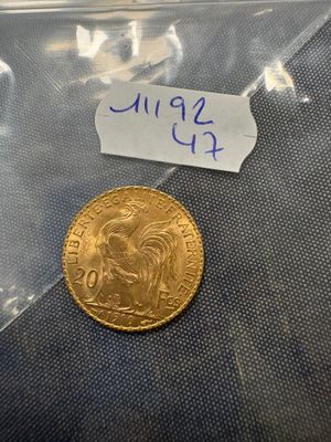 a close up of a coin in a plastic bag on a table