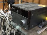 a black microwave sitting on a glass shelf in a room