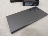 a black box with a black phone inside of it