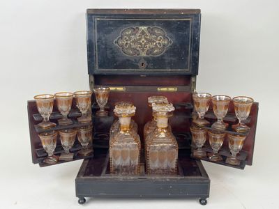 a wooden case with a lot of glasses in it