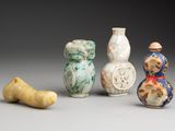 three small vases are sitting next to each other on a table