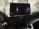 a car dashboard with a cell phone in the center of it