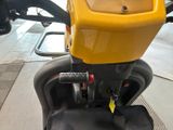 a close up of a seat on a yellow scooter