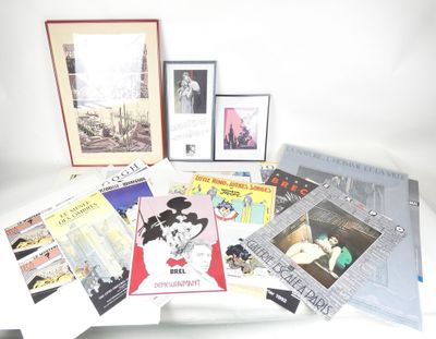a lot of books and pictures on a table