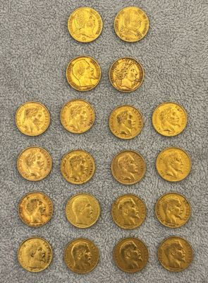 a pile of gold coins sitting on top of a blue towel