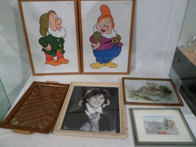 three framed pictures of snow white and seven dwarfs
