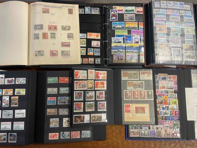 a lot of stamps on a table with a book