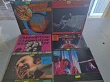 a lot of records on the table in the room