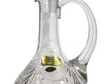 an image of a clear glass decanter with a gold top