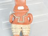 a clay figurine of a man with a top hat and pants