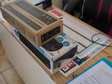 a box on top of a desk next to a chair