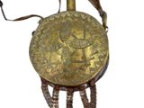 an image of a gold purse with a decorative design on it