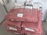 many bags of food sitting on top of a pile of bags