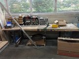 a workbench with a lot of boxes and tools on it