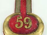a picture of a badge with the number 55 on it