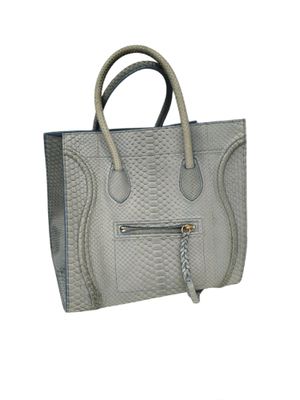 grey leather handbag with zippers and handles on a white background