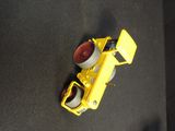 a yellow toy truck that is sitting on the floor