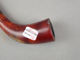 a pipe with a sticker on it sitting on a table