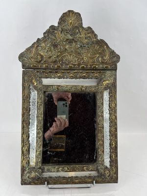 a person taking a picture of themselves in a mirror