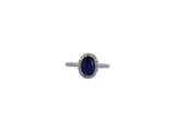 an image of a diamond and sapphire ring on a white background