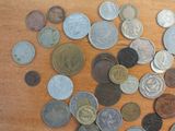 a lot of coins that are on the table
