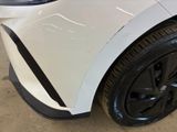 a close up of a white car with black rims