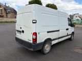 a white van that is parked in a parking lot