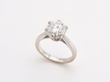 a close up of a diamond ring on a white background