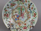 a plate with a picture of a woman and a bird on it