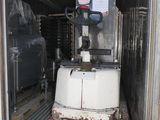 a machine that is sitting in the back of a truck