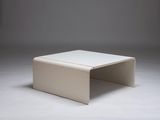 a white coffee table sitting on top of a white floor