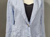 an image of a woman ' s blue jacket on a mannequin head