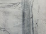 someone is drawing a picture of a car on a piece of paper