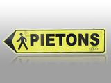 the sign is yellow and black with a man walking across it