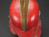 an image of a red helmet on a black surface