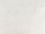 a white wall with a clock on it and a clock on it