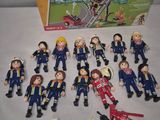 a box of playmobil with a bunch of people in it