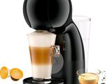 krups coffee machine with a cup of coffee next to it
