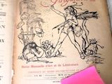 an old book with a drawing on it and a pink post it note