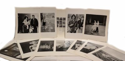 several black and white photographs of people and a dog on a table