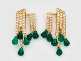 a pair of emerald and diamond earrings