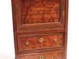 a wooden cabinet with a marble top on a white background