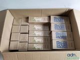 a cardboard box filled with lots of different types of soaps
