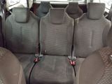 four seats in the back of a car that are empty