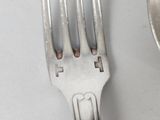 a fork and a spoon sitting on a table