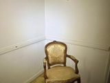 an image of a chair in a corner of a room