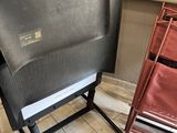 a chair that is sitting in a room next to a window